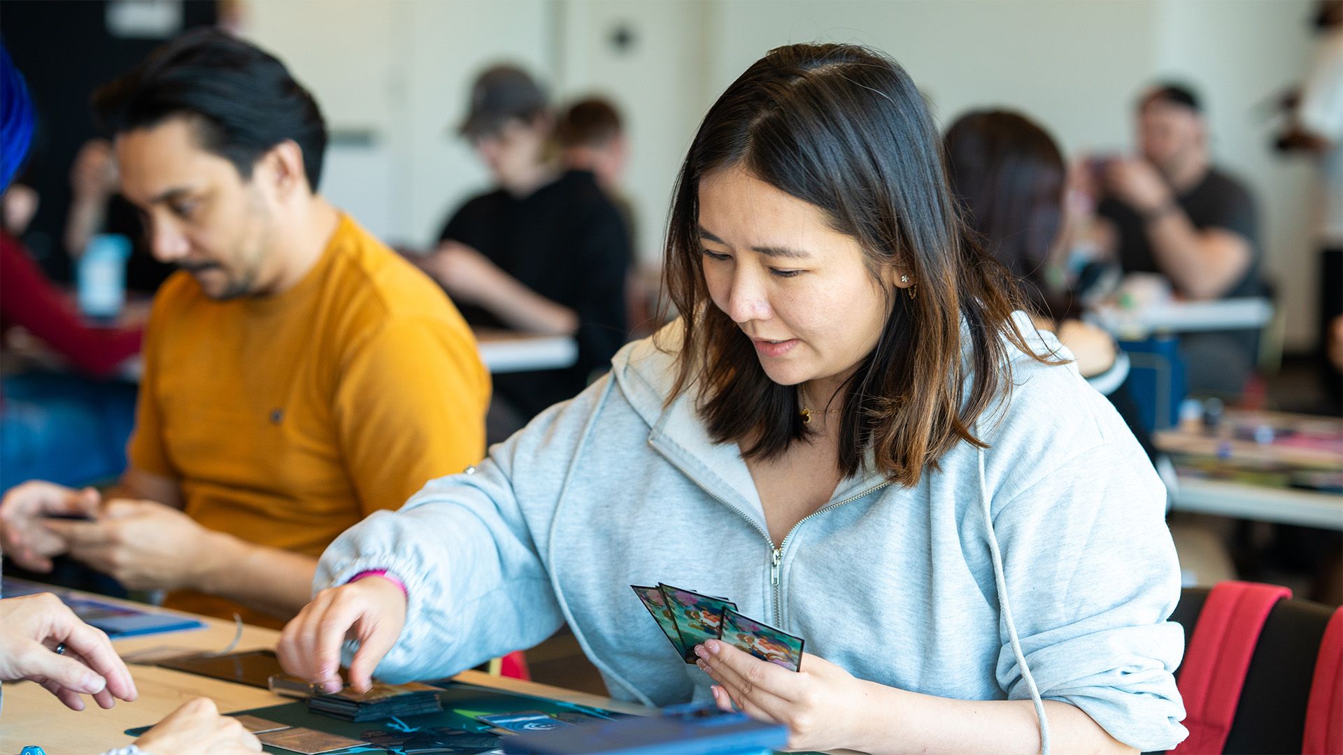 Players at a Riftbound event, from Riot's 2027 Local Play announcement.